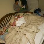 Nourit, Lilly, Avi, and Ming Ming in the Big Bed