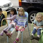Lukas, Oscar, Ming Ming, Nourit, Lilly, and Avi sit around in Saugatuck